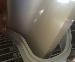 Curved stairlift rail over the landing