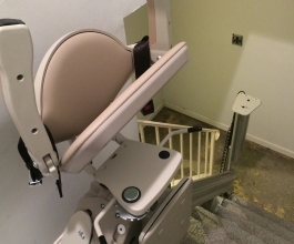 Residential stairlift with seat folded